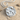 Aquarius Water Bearer Pendant, polished silver, product photo on beach sand