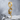 Dragon Wing Earring, gold vermeil, front view on stone surface