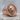Meander Lion Ring, rose gold, product photo on stone