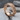 Autumn Leaf Wedding Ring, rose gold finish, angled product photo on stone