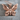 Folded Wing Butterfly Pendant, rose gold, product photo on stone