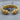 Geri Freki Rope Bracelet in gold vermeil, product photo on stone