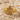 Fleur De Lis Crest Ring in gold vermeil, studio product photo