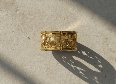 Detailed view of sterling silver bamboo border and tiger relief on handcrafted ring