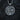 Close-up view of silver norse mythology pendant showing the warrior holding a sword with a raven flying above