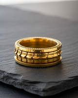 14K gold vermeil dragon scale spinner ring on 925 sterling silver base displayed on slate