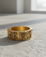 Gold vermeil guardian knight ring featuring winged angel and sword relief on textured surface
