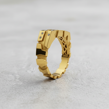 Gold vermeil geometric block ring with faceted design and small gemstones on grey background