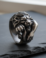 Side angle of sterling silver lion ring showing heavy band construction and realistic fur texture design