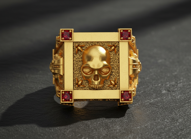 Gold vermeil silver vampire skull ring featuring red corner stones and textured square face