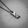 925 sterling silver rustic pendant with oxidized textured finish on stone background