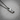 Angled view of 925 sterling silver rustic bar pendant on chain with distressed texture and oxidized finish