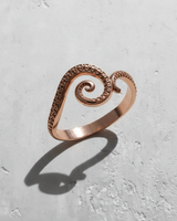 Rose gold plated 925 sterling silver octopus tentacle ring featuring detailed suckers and spiral design