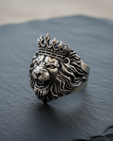 Close-up of 925 sterling silver lion head ring with crown showing oxidized details and ferocious roaring design