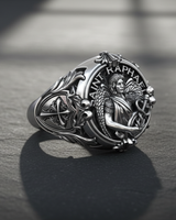 Side view of handcrafted religious ring showing cross shield emblem and intricate floral engraving