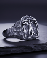 Side profile of textured 925 sterling silver signet ring with rugged rock finish and art motif