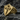 Close-up of premium Santiago Cross signet ring resting on a dark stone background highlighting elegant metalwork