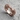 Two Headed Lion Ring, rose plated silver, angled view on stone