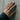 Wild Horse Ring, worn on model hand against concrete wall