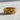 Paw Print Ring in gold vermeil, front view showing textured animal track pattern