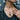 Clasped Praying Hands Pendant worn on model around the neck