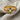 Close-up of premium Orthodox cross ring resting on linen fabric highlighting the intricate cyrillic prayer inscription