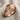 Overlapping Leaf Ring, rose plated silver, angled view on linen fabric