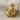 Clawing Lion Pendant in gold vermeil, angled front view on woven fabric
