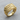 Detailed angled view of the gold royal flush poker ring resting on a textured wooden cross section surface