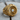 Detailed front view of the aviation-inspired turbine engine ring resting on a textured wooden surface.