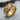 Close-up of the intricately detailed eagle ring resting on natural wood, highlighting the premium craftsmanship