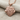 Twin Lion Pendant, rose gold, front view on fabric