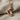 Hockey skate pendant in rose gold, front view on fabric