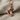 Hockey skate pendant in rose gold, front view on fabric