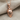 Hockey Goalie Mask Pendant, rose gold, front view on fabric
