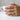 Lifestyle view of the vintage filigree band ring worn on a woman's hand holding a white mug, showing elegant details.