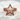 Chevron Nautical Star Ring, rose plated silver, front view on stone surface