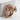 Gemstone Elephant Ring, rose gold, angled view on stone base