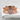 Love Heart Ring, rose plated silver, front view on stone surface