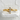 Detailed view of the handcrafted three stone bypass ring resting gracefully on a white textured stone background