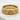 Detailed angled view of the Celtic Claddagh ring resting on a textured white stone highlighting the knotwork band