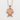 Crossed Angel Wings Pendant, rose gold finish, front view on white