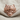 Wolf Pelt Skull Ring, rose plated silver, front view on fabric