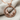 Two Mice Pendant, rose gold, close-up with chain on fabric