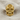 Gothic Rosette Skull Ring, gold vermeil, front view on linen
