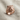Growling Tiger Ring, rose gold, three-quarter view on textured fabric