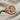 Orixa Oxossi Ring, rose plated silver, angled front view