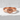 Lotus Blossom Ring, rose gold, front view on stone surface