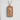 Seigaiha Koi Fish Pendant, rose gold, front view on stone display