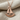 Hammered Sailboat Pendant, rose plated silver, product photo on linen